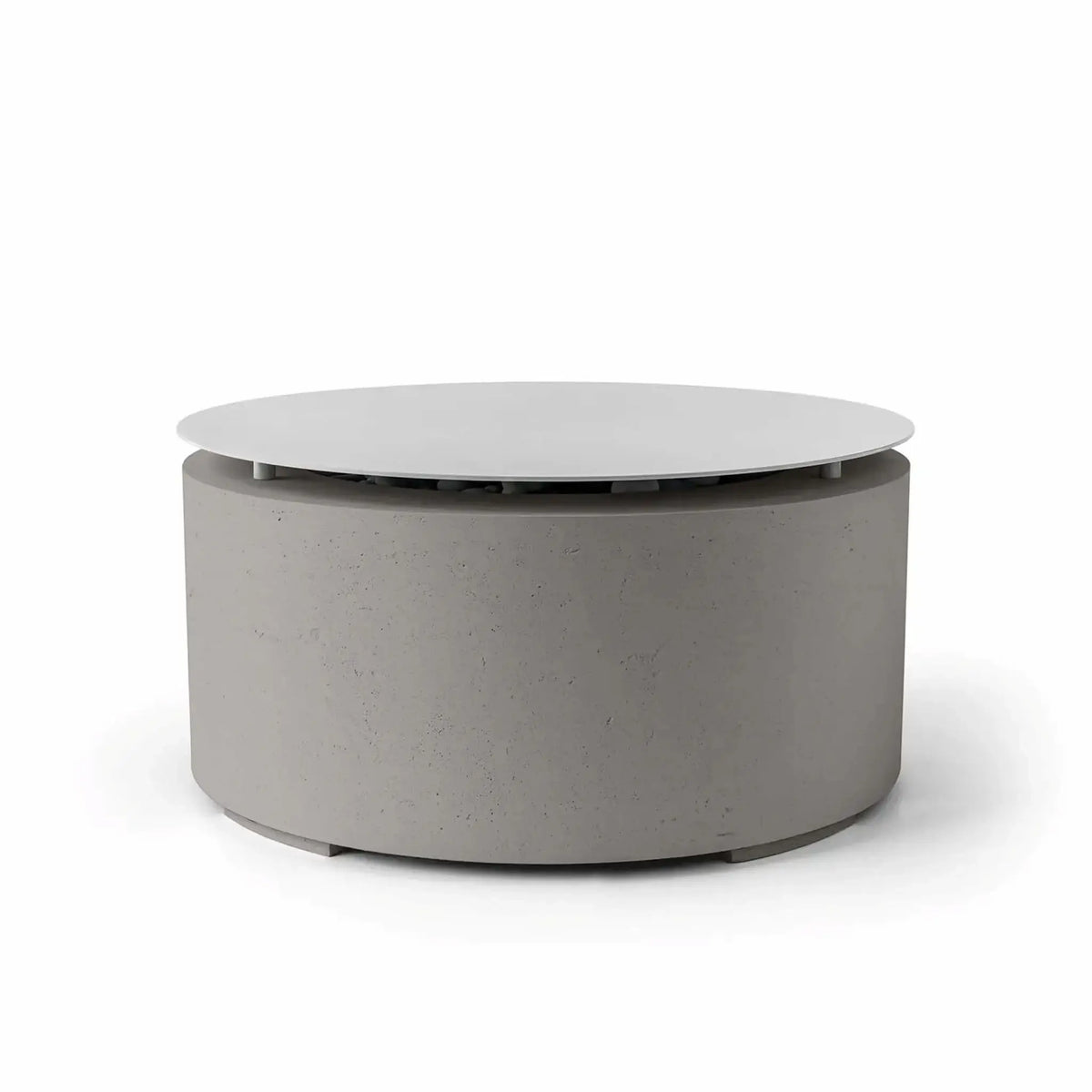HPC Fire Hearth Products Controls Dekko GFRC Concrete Belmont Fire Pit in Sandstone finish with integrated Table Top Lid. This modern outdoor fire pit showcases a neutral sandstone-gray concrete finish, durable GFRC construction, and a circular cover that conceals the fire media area when not in use. The Belmont Fire Pit delivers both decorative appeal and practical tabletop functionality for upscale outdoor living environments.
