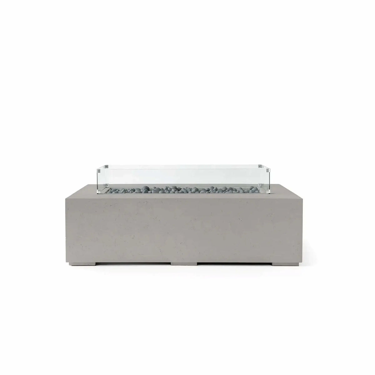 HPC Fire Hearth Products Controls Dekko GFRC Concrete Sonoma 56 x 30 Fire Pit in Sandstone finish with Slate Stone media and a tempered glass wind guard. The rectangular fire pit features durable GFRC concrete construction, decorative gray slate stones within the linear burner opening, and a clear wind guard mounted above the fire area. Its warm sandstone tone and modern silhouette make it a stylish centerpiece for patios, terraces, and outdoor conversation spaces.