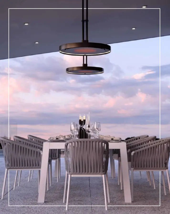 Modern dual-disc ceiling-mounted patio heater warming a stylish outdoor dining area, perfect for year-round comfort and ambiance.