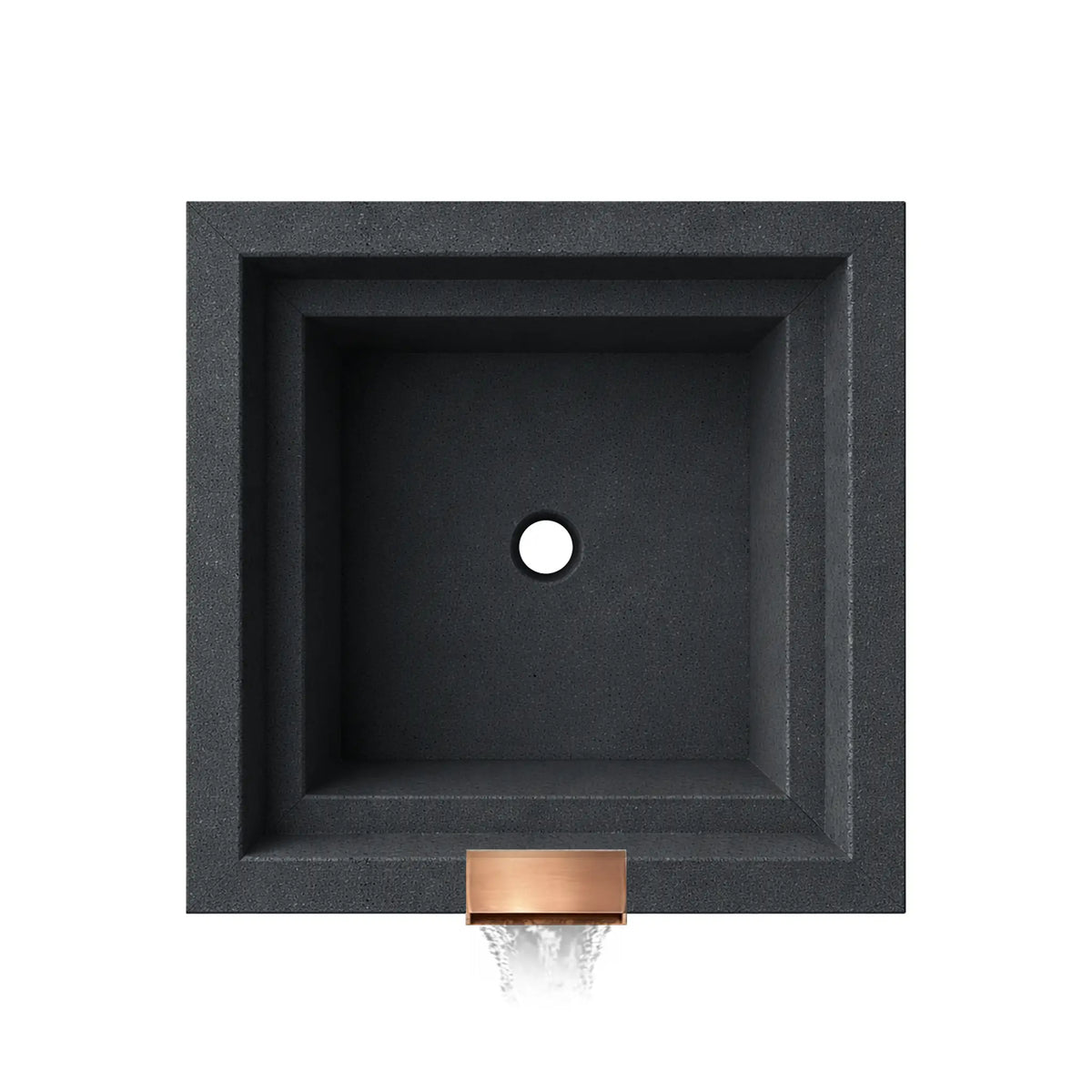 Top-down view of the graphite Serenity Series square ripple water bowl showing the empty basin interior and centered drain opening. The stepped square interior walls and textured graphite finish highlight the clean geometric design, while the copper spillway opening is visible at the front edge where water exits the bowl to create a decorative waterfall feature.