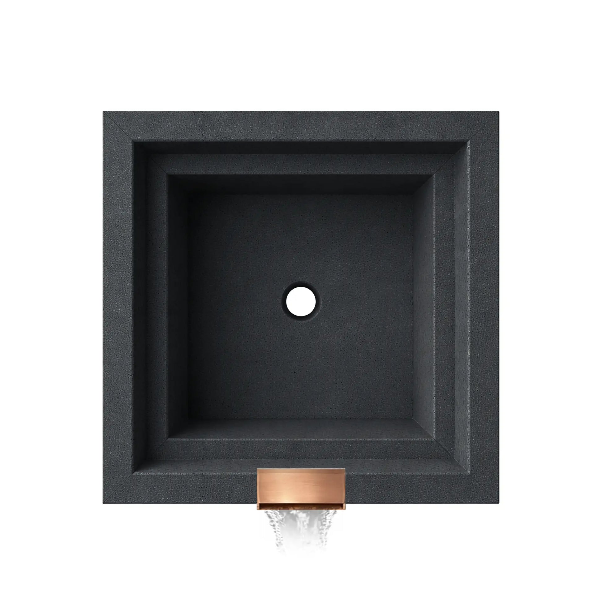 Top-down view of the graphite Serenity Series square ripple water bowl showing the empty basin interior and centered drain opening. The stepped square interior walls and textured graphite finish highlight the clean geometric design, while the copper spillway opening is visible at the front edge where water exits the bowl to create a decorative waterfall feature.