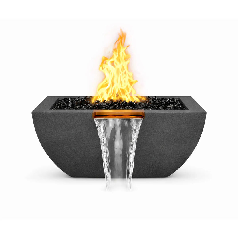 Front-facing product view of the black Serenity Series square rounded fire and water bowl. A bright flame rises above black fire glass media while a copper waterfall spillway pours a smooth sheet of water downward from the center of the bowl, showcasing the combined fire and water feature design.