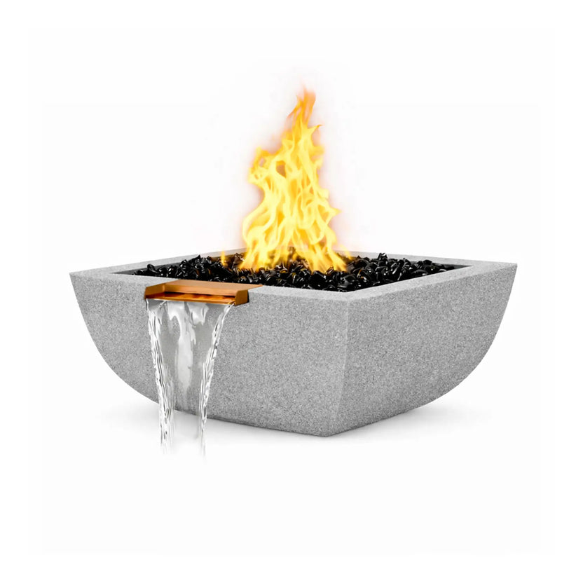 Gray Serenity Series square rounded fire and water bowl burning with a bright flame above black fire glass. A copper spillway built into the bowl produces a clean waterfall stream flowing downward. The textured GFRC concrete finish and curved bowl shape give the feature a modern architectural appearance.