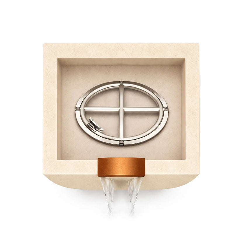 Top interior view of a white Serenity Series square curved fire and water bowl showing the stainless steel burner ring assembly mounted inside the recessed basin. The copper waterfall outlet at the front edge directs water flow downward, illustrating the bowl’s internal burner configuration before fire glass is installed.