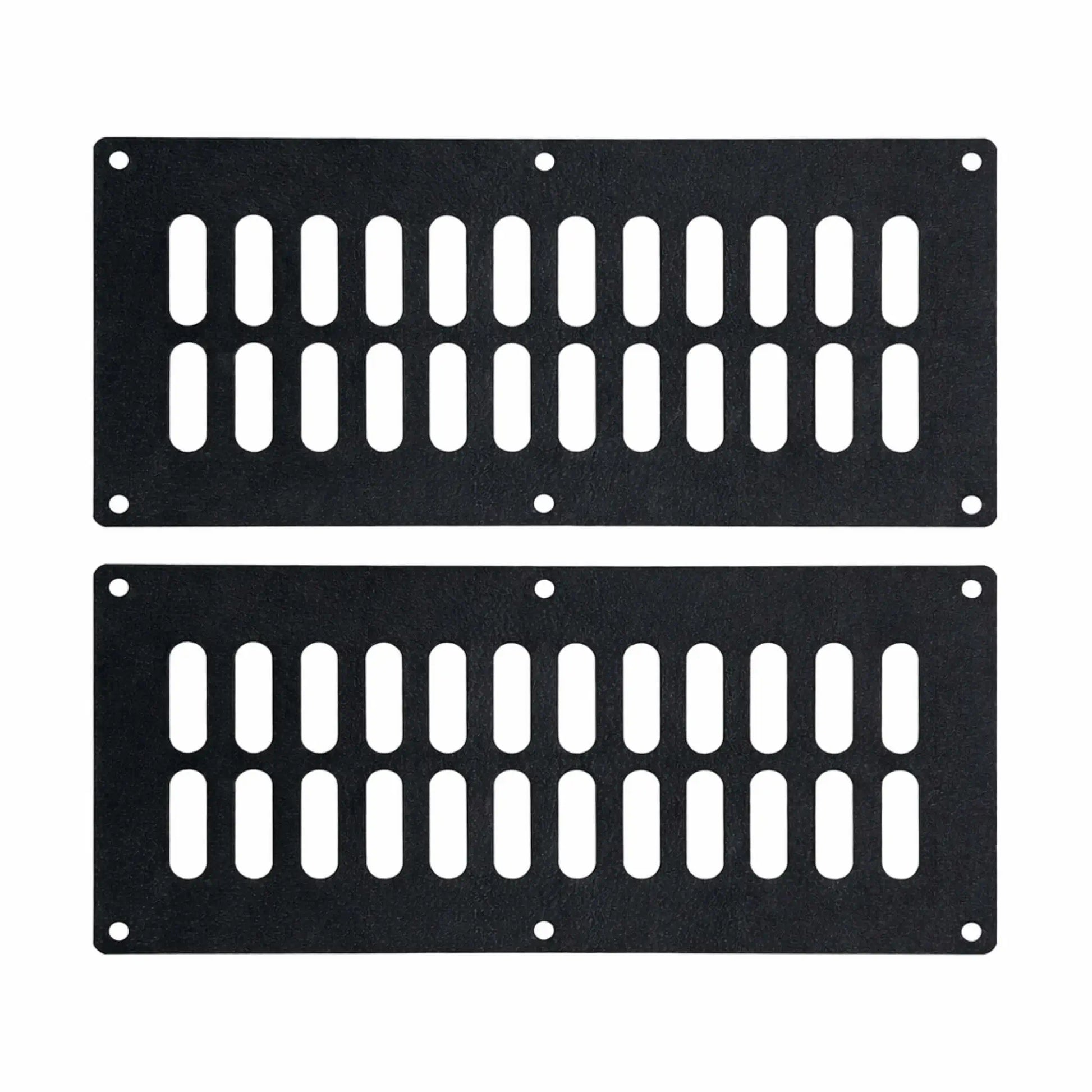 Set of two rectangular black steel fire pit vent panels featuring evenly spaced vertical slots and pre-drilled mounting holes, designed to improve airflow and ventilation in outdoor gas fire pit enclosures.