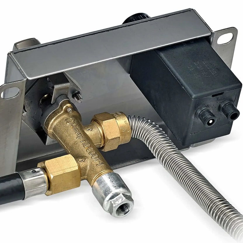 Rear view of the American Fire Products CSA-certified EIPS control panel showing the stainless steel mounting bracket, brass gas valve assembly, flexible gas line, electrical ignition module, and connection ports used for safe electronic ignition fire pit operation.