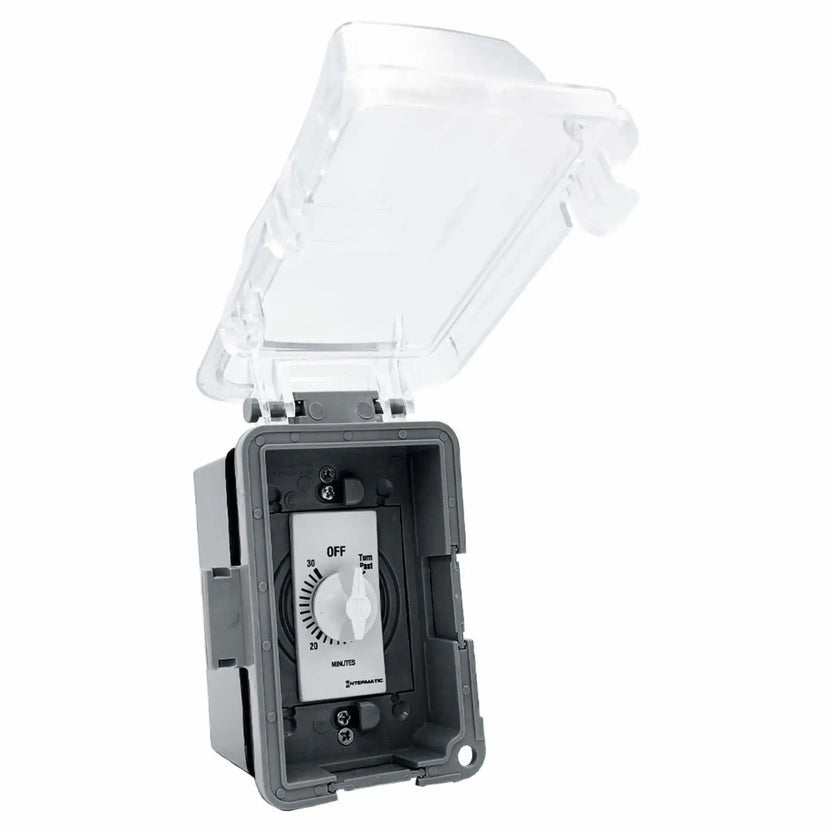 Open extra-duty weatherproof electrical box displaying a 30-minute Intermatic wall timer inside, with a transparent hinged lid and deep gray housing built for outdoor electronic ignition control installations in wet environments.