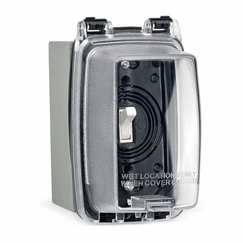 Extra-duty weatherproof electrical enclosure with clear protective cover concealing a standard ON/OFF wall switch, designed for outdoor fire pit ignition control and wet location applications.