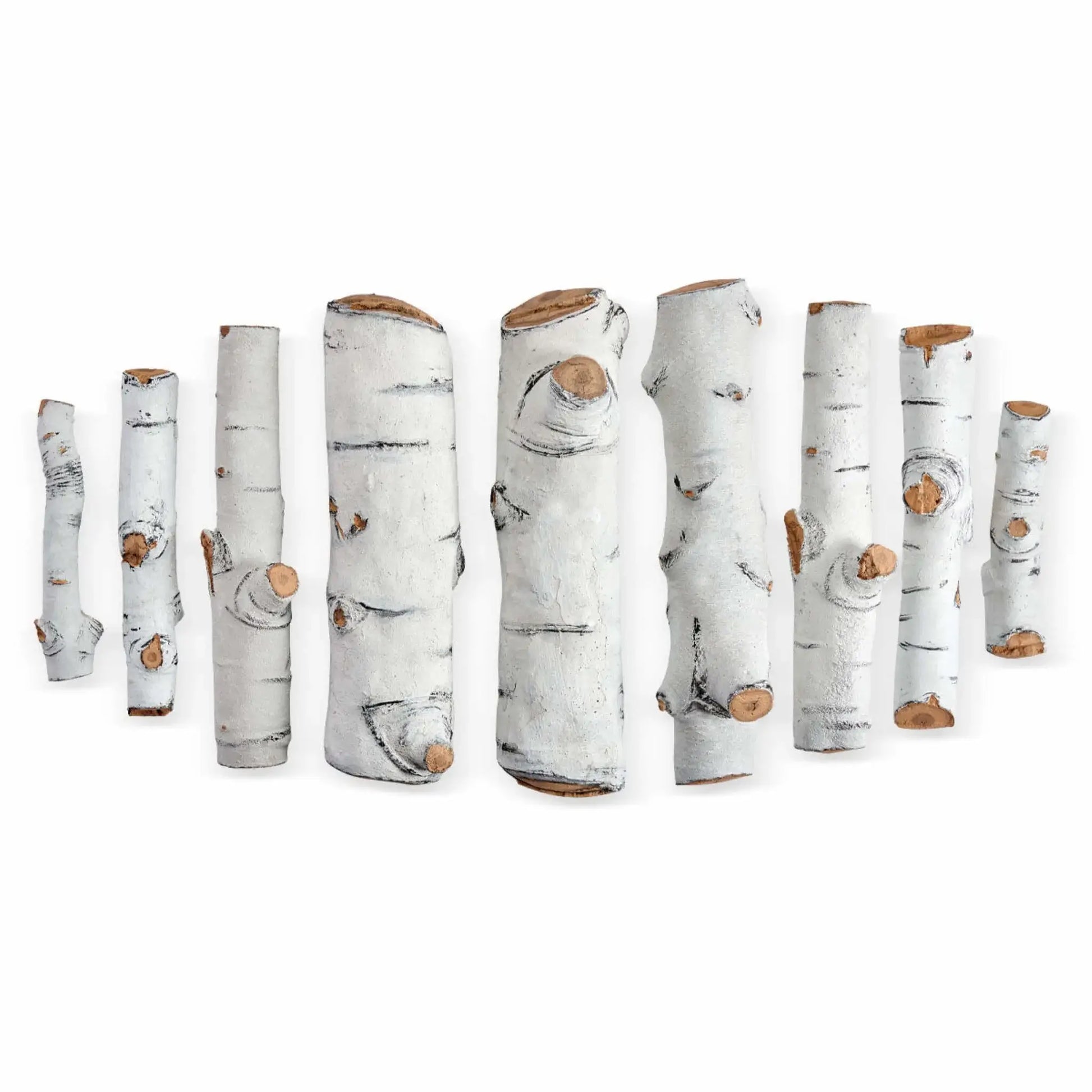 Nine individual Sierra Birch ceramic gas fire pit logs laid out separately on a white background, displaying varied lengths, branch-style shapes, and authentic birch bark detailing with exposed wood ends for custom log placement in gas fire pits.