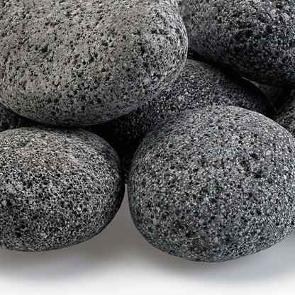 Close-up view of Large gray lava stones highlighting their rough, pitted volcanic surface, natural speckling, and uneven texture that enhances flame dispersion in fire pit burners.