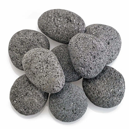 Top-down view of Large gray lava stones arranged in a clustered layout, showing their rounded edges, natural variation in tone, and porous volcanic texture on a clean white surface.