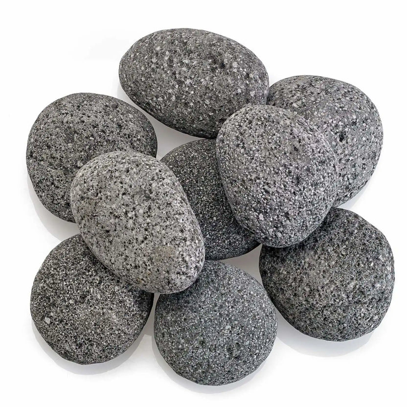 Top-down view of Large gray lava stones arranged in a clustered layout, showing their rounded edges, natural variation in tone, and porous volcanic texture on a clean white surface.