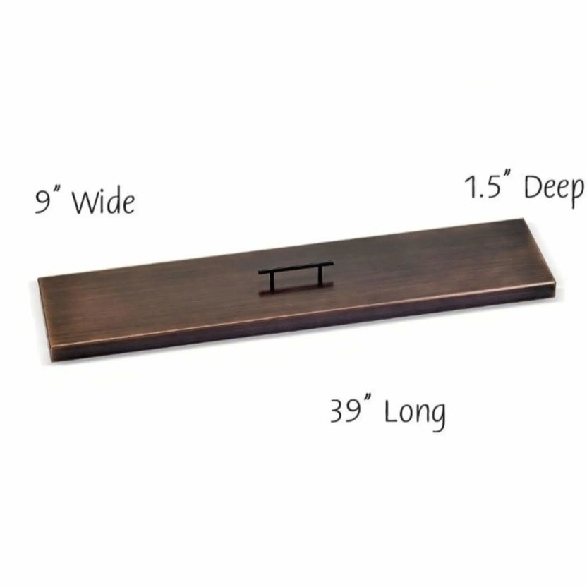 36-inch linear oil rubbed bronze fire pit burner cover with a flat rectangular profile, brushed bronze finish, and centered handle for clean coverage of narrow fire pit openings.