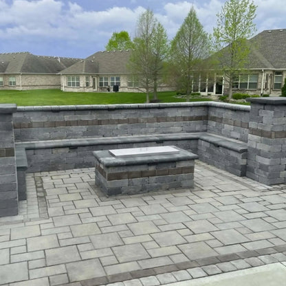 Rectangular stainless steel fire pit burner cover installed on a modern stone fire feature, offering a clean brushed finish that converts the fire pit into a usable tabletop.
