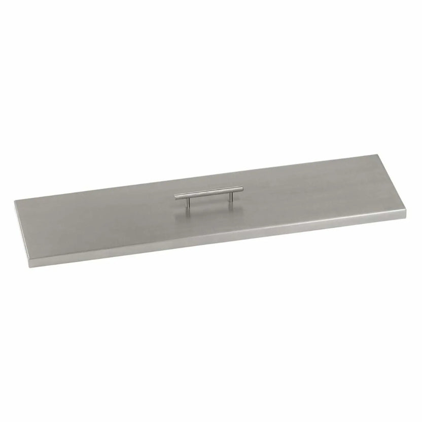 Linear stainless steel fire pit burner cover with a smooth brushed finish and centered lift handle, shown on a white background to highlight its low-profile design and corrosion-resistant construction.