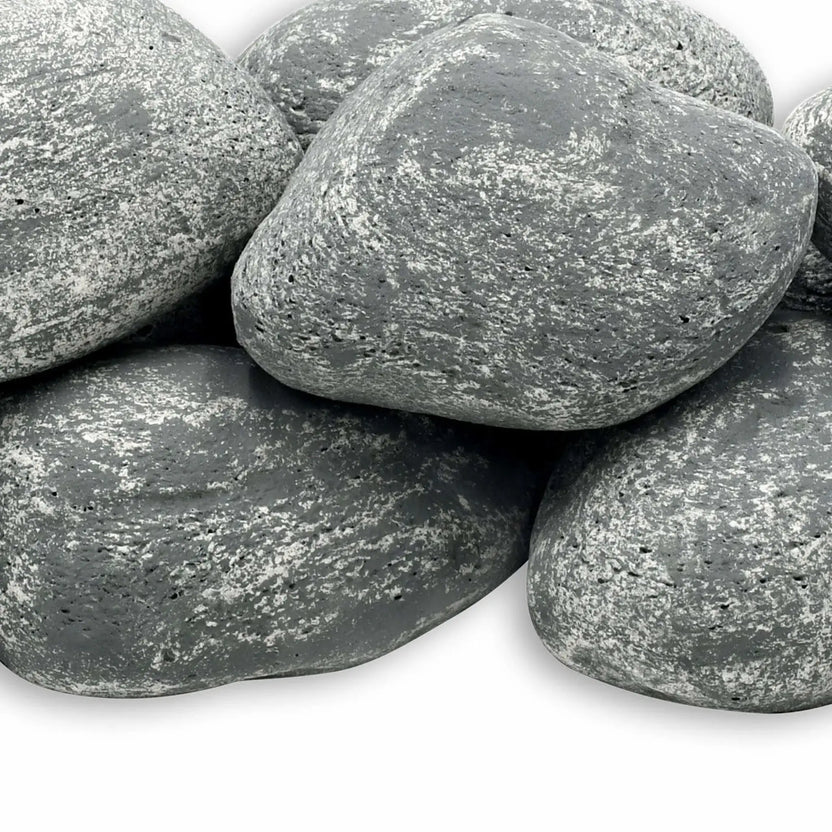 Close-up view of American Fire Products Lite Cobble Stones in Cape Gray, featuring smooth, rounded fire pit stones with a soft gray tone and natural white speckled texture, designed to mimic real river rock for gas fire features.