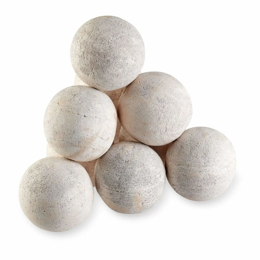 Pyramid stack of six Cottage White 4-inch Lite Stone fire balls, highlighting the natural matte texture and subtle gray-beige speckling on a white studio background.