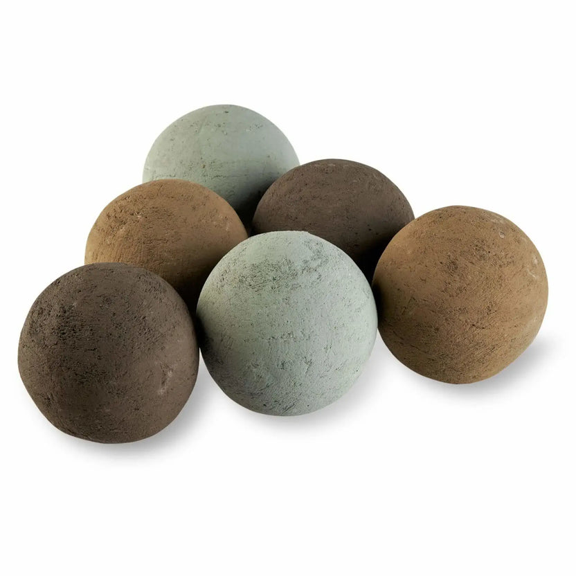 Studio product photo of six 4-inch fire balls in natural earth tones, sage green, tan, and brown, grouped on a white background with a lightly textured stone finish.