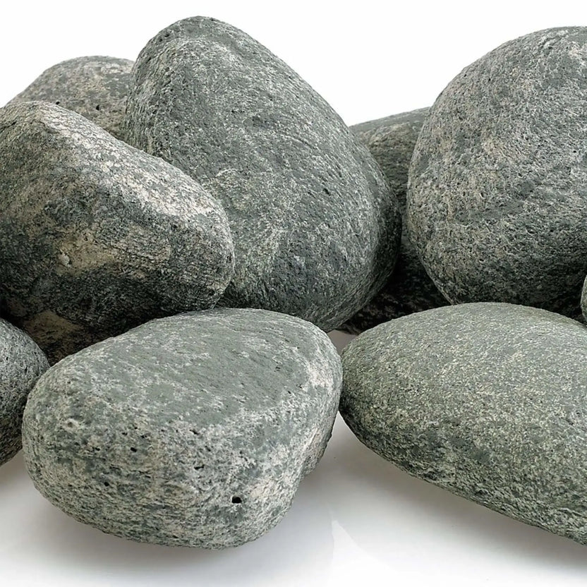 Close-up view of American Fire Products Cape Gray Lite Stones showing detailed surface texture, natural color variation, and smooth rounded edges ideal for use in gas fire pits and fireplaces.