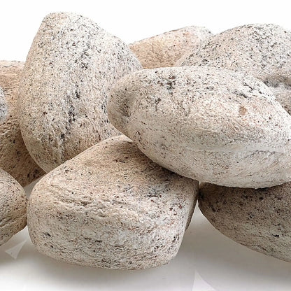 Close-up of Cottage White Lite Stones by American Fire Products showing smooth rounded shapes, light off-white coloring, and natural speckled texture designed for use in gas fire pits and fireplaces.