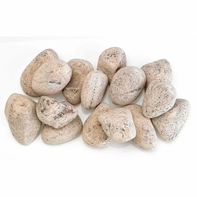 Top view of Cottage White Lite Stones by American Fire Products arranged across a linear fire pit burner, showcasing uniform rounded shapes, soft white tones, and subtle stone texture.