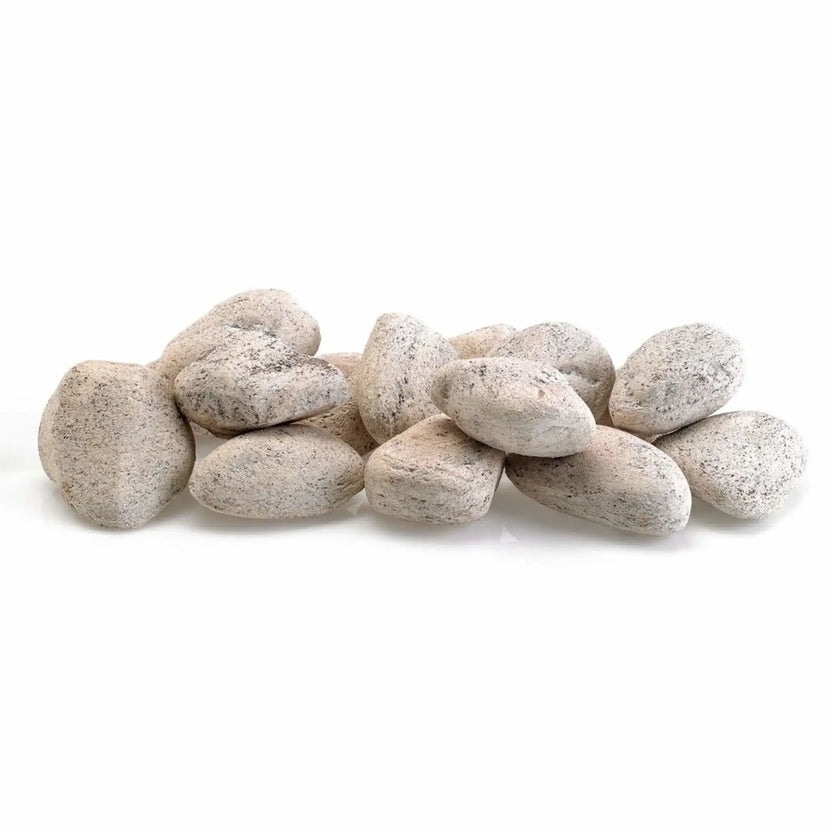 Cottage White Lite Stones by American Fire Products arranged in a loose pile, featuring light off-white tones with subtle speckling and smooth stone surfaces for gas fire pits and fire tables.