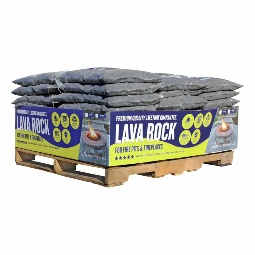 Pallet display of American Fire Products medium lava rock in bulk bags, labeled for fire pits and fireplaces with premium quality lifetime guarantee packaging.