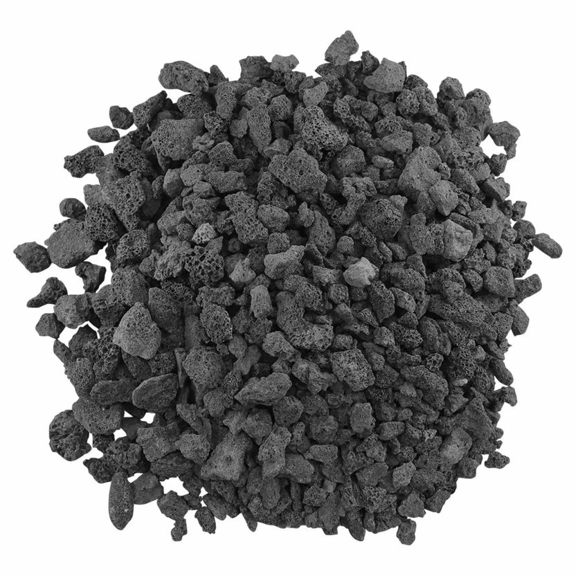 Top view of medium black lava rock pieces with natural porous structure, commonly used as base filler for gas fire pit burners and fireplace installations.
