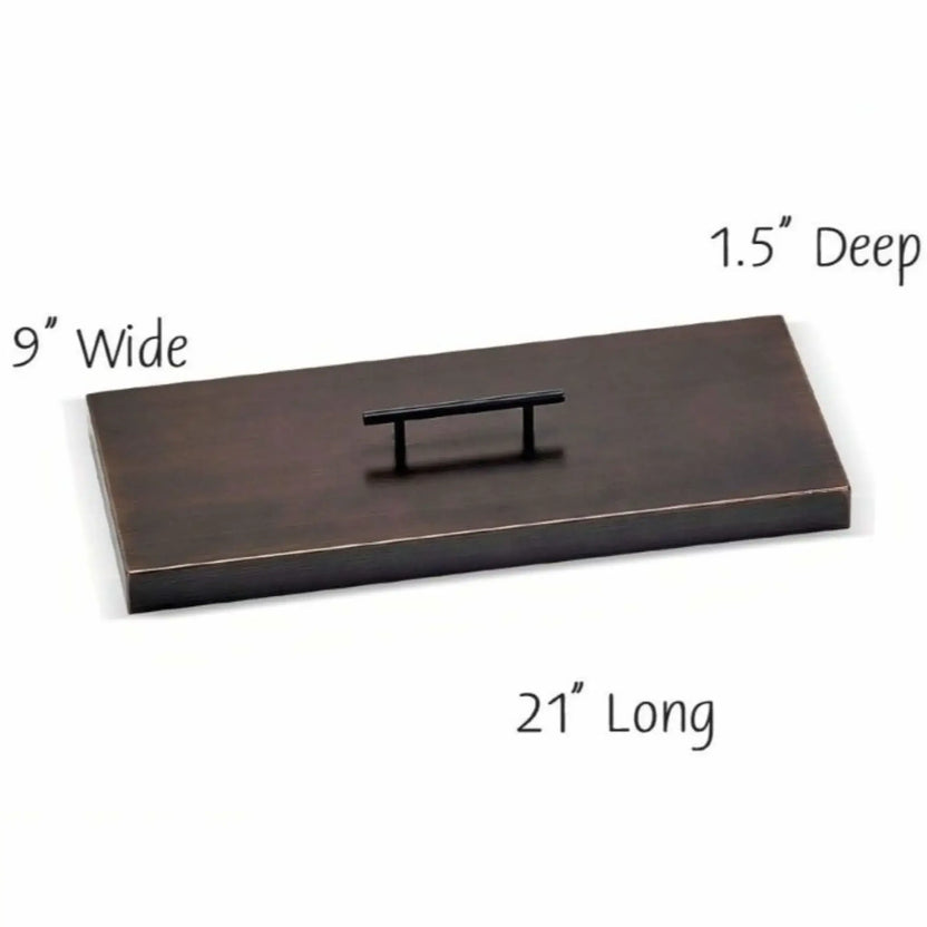 18 x 6 inch rectangular oil rubbed bronze burner cover featuring a smooth metal finish and integrated handle, designed to shield a compact fire pit burner and create a flat surface for outdoor tables.
