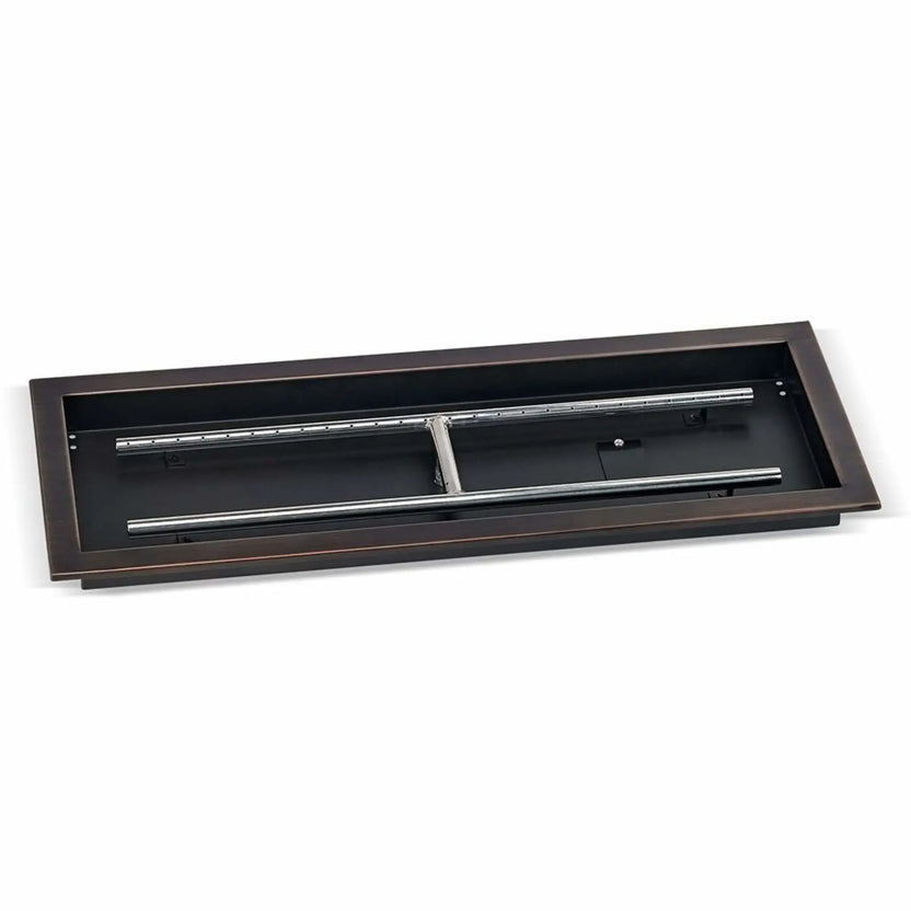 Large oil-rubbed bronze rectangular drop-in burner pan measuring 30 by 10 inches, displayed at an angle to highlight the deep pan construction, stainless steel burner bars, and mounting flange for outdoor fire tables.