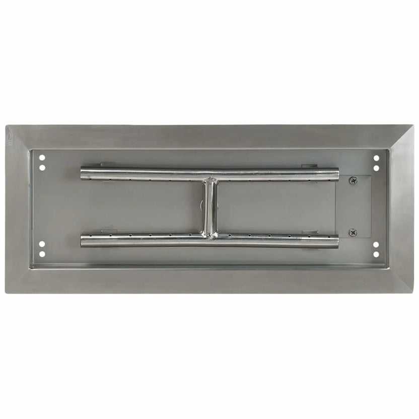 Top-down view of an 18 by 6 inch stainless steel rectangular drop-in burner pan, highlighting the clean pan interior, stainless steel burner tubes, center support bracket, and precision-drilled flame ports.