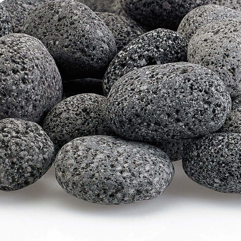 Close-up of small lava rocks showing detailed pitting, natural gray color variation, and rough volcanic surface designed to enhance flame spread and airflow in fire features.