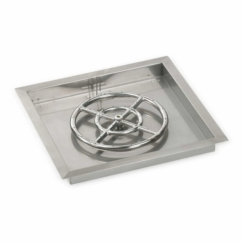 Square stainless steel drop-in fire pit burner pan with a larger circular burner assembly mounted in the center. The pan features beveled edges, a polished burner ring with evenly spaced flame ports, and a deep basin suitable for outdoor fire pit builds.