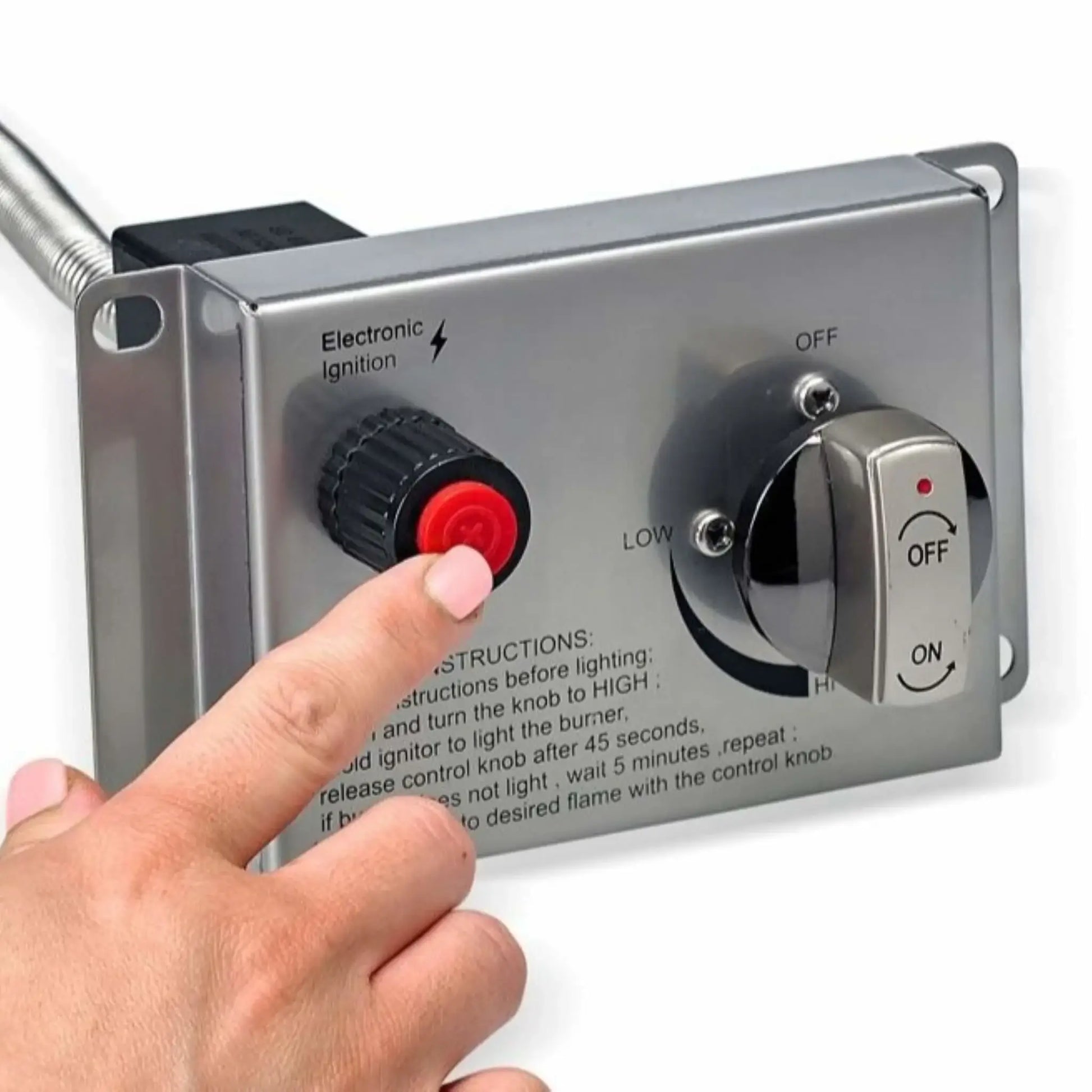 Close-up image of a stainless steel fire pit control panel with a hand pressing the red electronic ignition button next to the gas control knob. The panel displays labeled ignition and flame adjustment settings, demonstrating how the CSA-certified fire feature is manually ignited and controlled for safe outdoor operation.