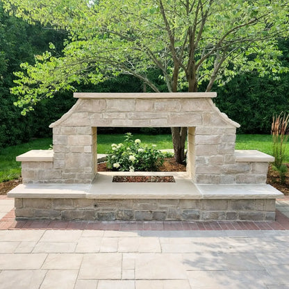 Custom outdoor stone fireplace structure designed for a stainless steel H burner installation, featuring a wide firebox opening and natural stone surround ready for fire glass media.
