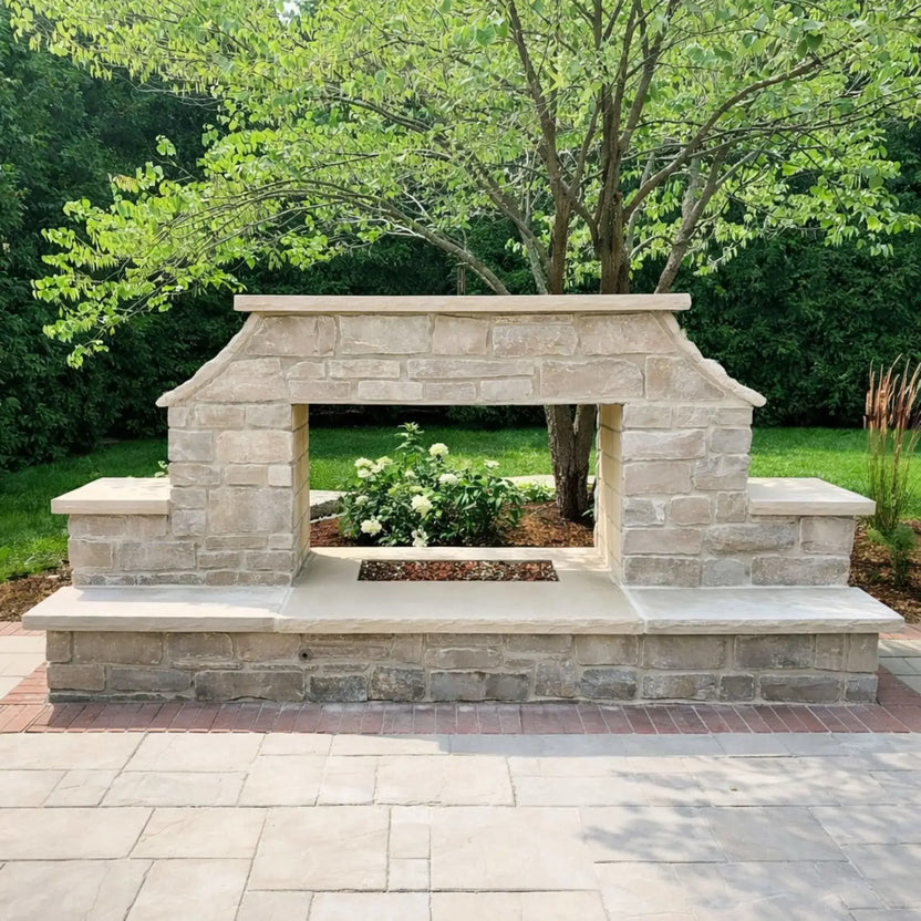 Custom outdoor stone fireplace structure designed for a stainless steel H burner installation, featuring a wide firebox opening and natural stone surround ready for fire glass media.