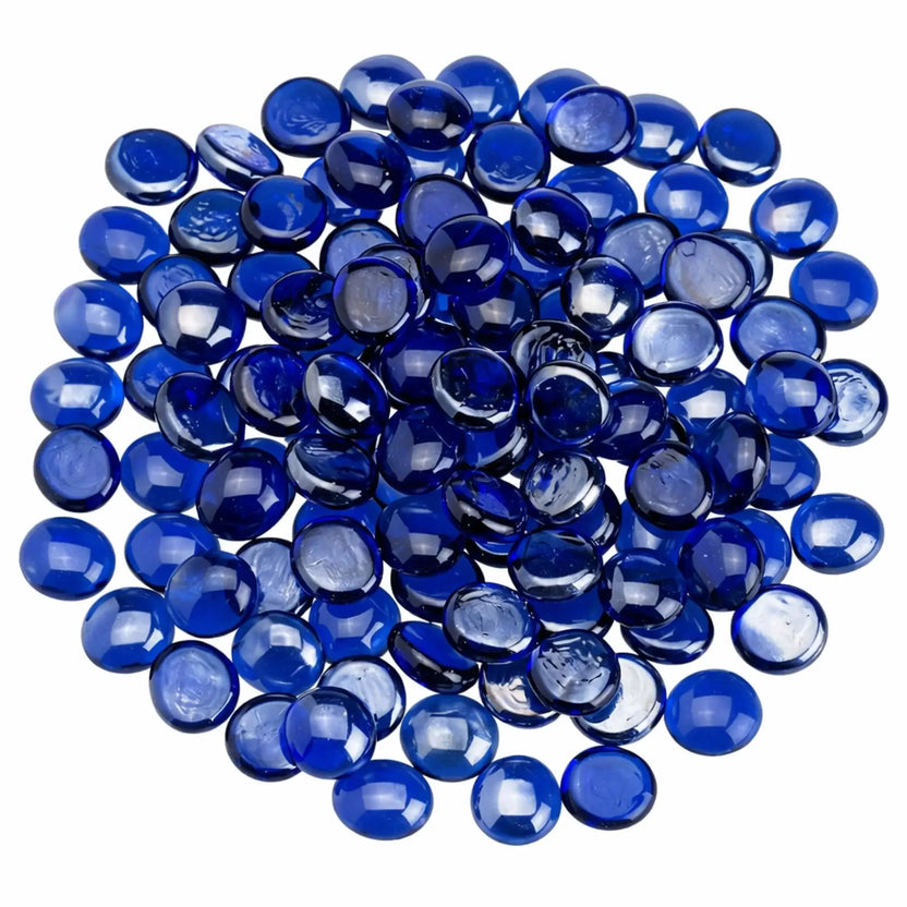 Top view of royal blue tempered glass fire pit beads spread in a circular arrangement, emphasizing their deep blue tone, smooth drop shape, and glossy reflective finish.