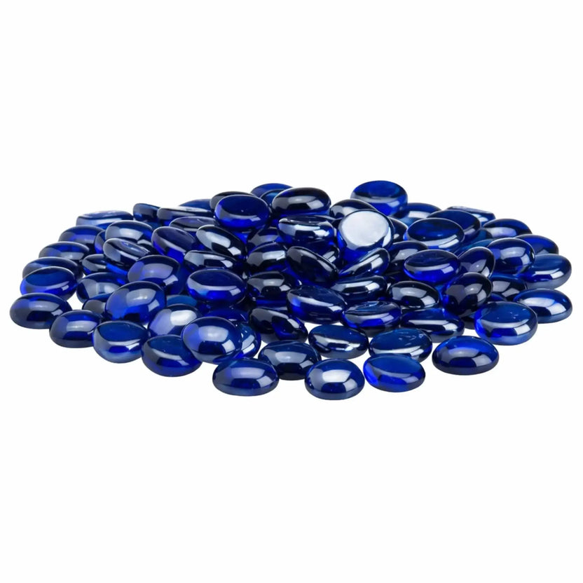 Pile of royal blue tempered glass fire pit beads with a deep cobalt hue, smooth rounded drop shape, and high-gloss luster surface displayed on a clean white backdrop.