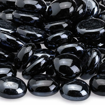 Detailed close-up of twilight black fire glass beads showing their smooth polished surface, deep black color, rounded edges, and reflective tempered glass texture.