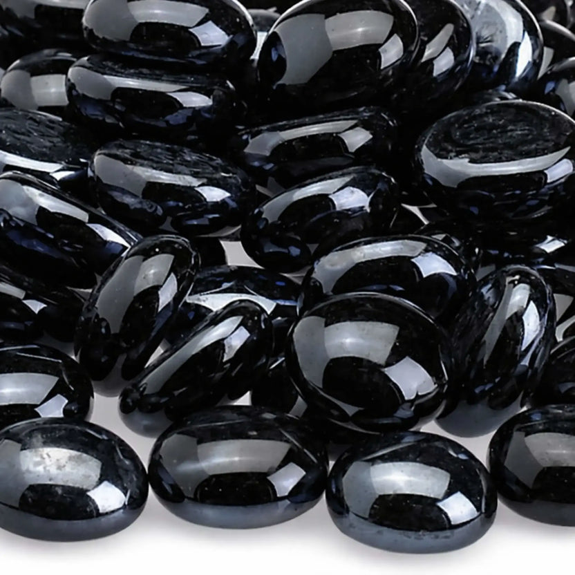 Detailed close-up of twilight black fire glass beads showing their smooth polished surface, deep black color, rounded edges, and reflective tempered glass texture.