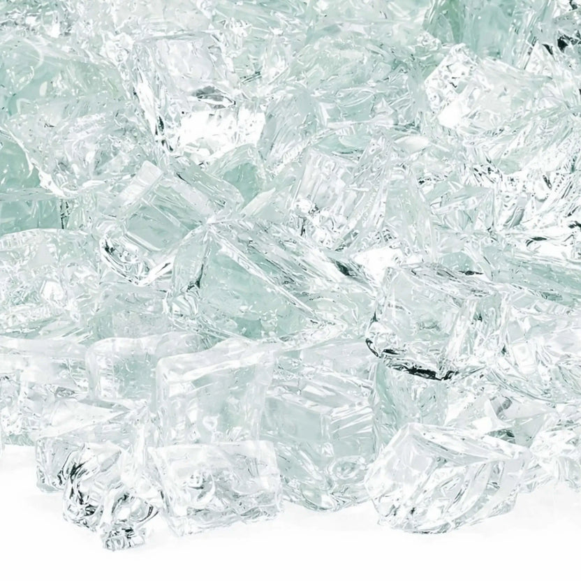 Detailed macro image of clear 1/2 inch non-reflective tempered fire glass, showcasing transparent chunky pieces with light-reflecting facets and subtle texture, engineered for decorative gas fire pit media applications.