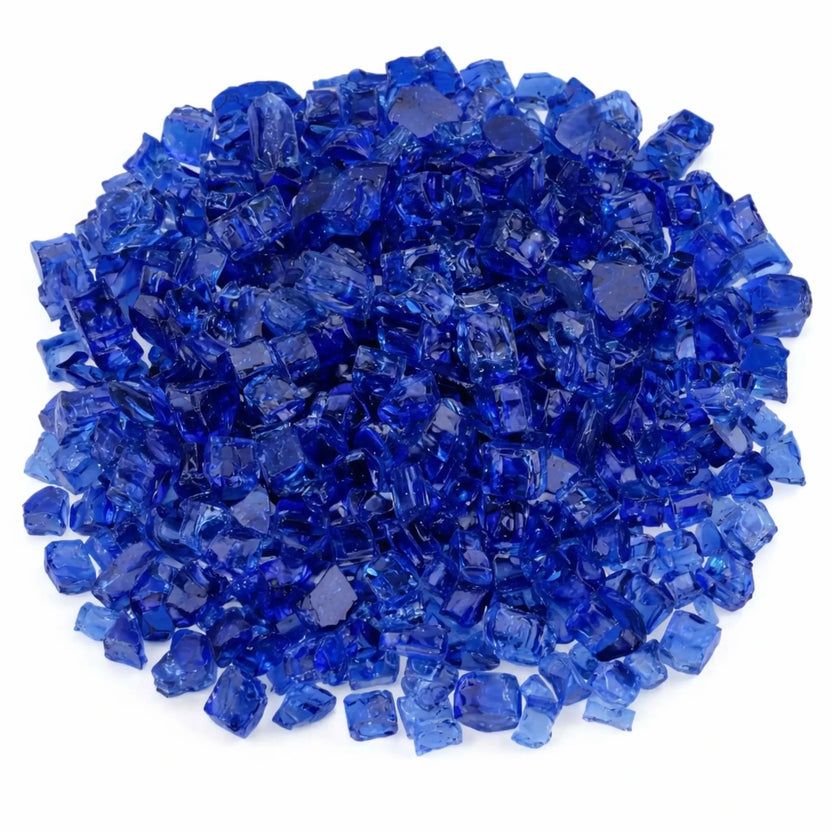 Overhead view of American Fire Products 1/2 inch Classic Non-Reflective Cobalt Blue tempered fire glass arranged in a dense circular pile, showcasing rich sapphire tones, smooth tumbled edges, and consistent sizing ideal for evenly covering a linear gas fire pit burner.