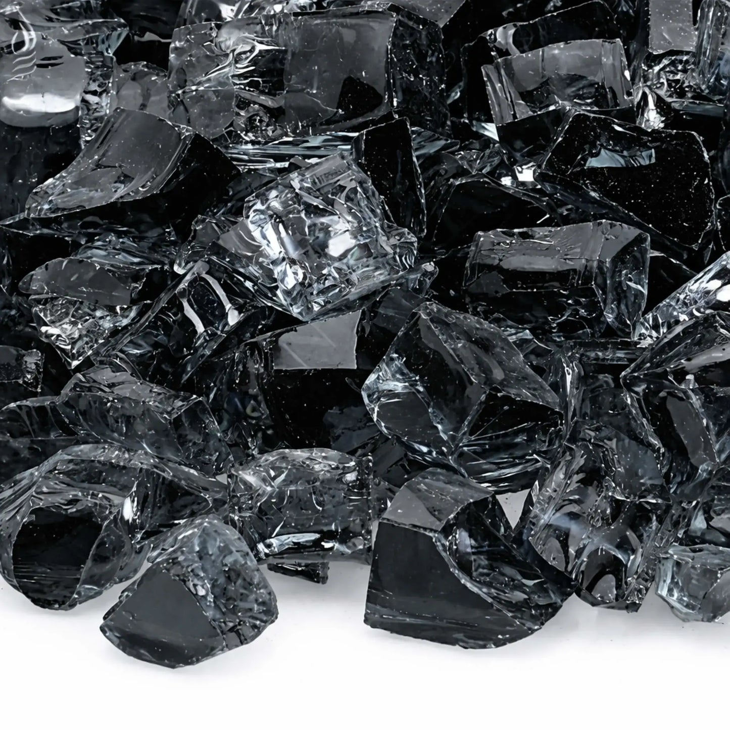 Macro close-up of gray 1/2 inch non-reflective tempered fire glass pieces, showing layered smoky tones, subtle transparency, and polished surfaces designed to reduce glare while enhancing flame presentation in gas fire features.