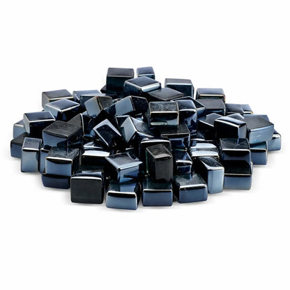 A close-up view of glossy black tempered glass fire pit cubes in a 1/2-inch size, featuring a reflective luster finish. The smooth, polished cube shapes are piled together against a clean white background, highlighting their deep black color and mirror-like shine; ideal for modern gas fire pits and fireplaces.