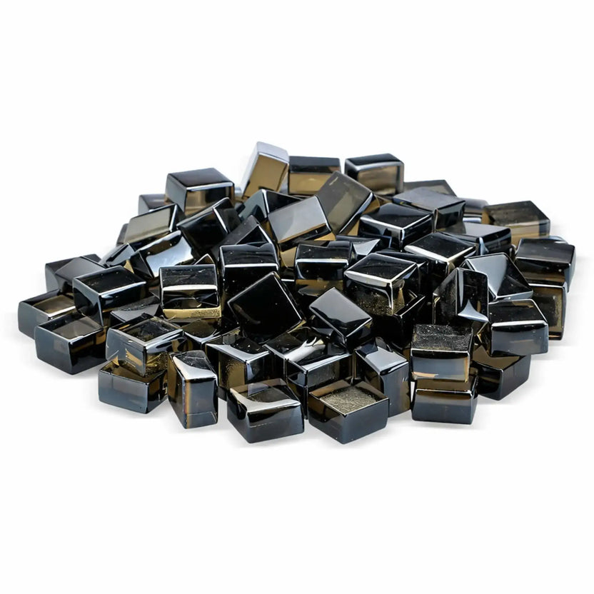 Studio image of bronze Luster 2.0 half-inch tempered fire glass cubes from American Fire Products, stacked in a small mound against a clean white backdrop. The warm bronze tint and glossy finish add a rich, metallic-inspired accent to gas fire pits and fireplaces.