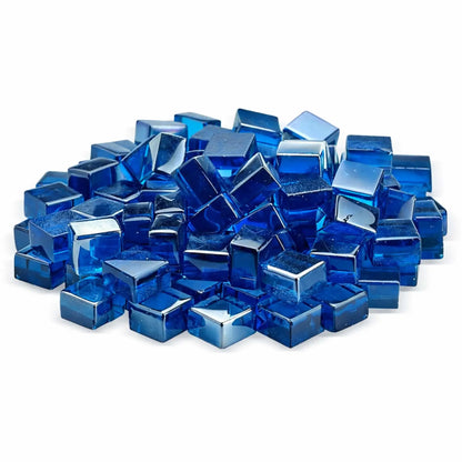 Studio image of Pacific blue Luster 2.0 half-inch tempered fire glass cubes stacked together on a white background. The vivid sapphire-blue color and high-gloss finish give each cube a jewel-like appearance, perfect for adding bold color to gas fire pits and fireplaces.