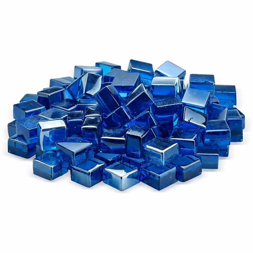 Studio image of Pacific blue Luster 2.0 half-inch tempered fire glass cubes stacked together on a white background. The vivid sapphire-blue color and high-gloss finish give each cube a jewel-like appearance, perfect for adding bold color to gas fire pits and fireplaces.