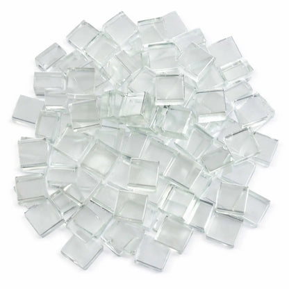 Top-down view of Starfire clear white half-inch tempered fire glass cubes arranged in a loose circular pile on a white surface. The clear, ice-like cubes display a smooth, reflective finish that adds sparkle and modern appeal to gas fire pits and fireplaces.