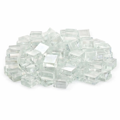 Studio image of Starfire clear white Luster 2.0 half-inch tempered fire glass cubes stacked in a mound against a bright white backdrop. The transparent cubes feature a crisp, icy appearance with high-gloss surfaces that reflect light beautifully.