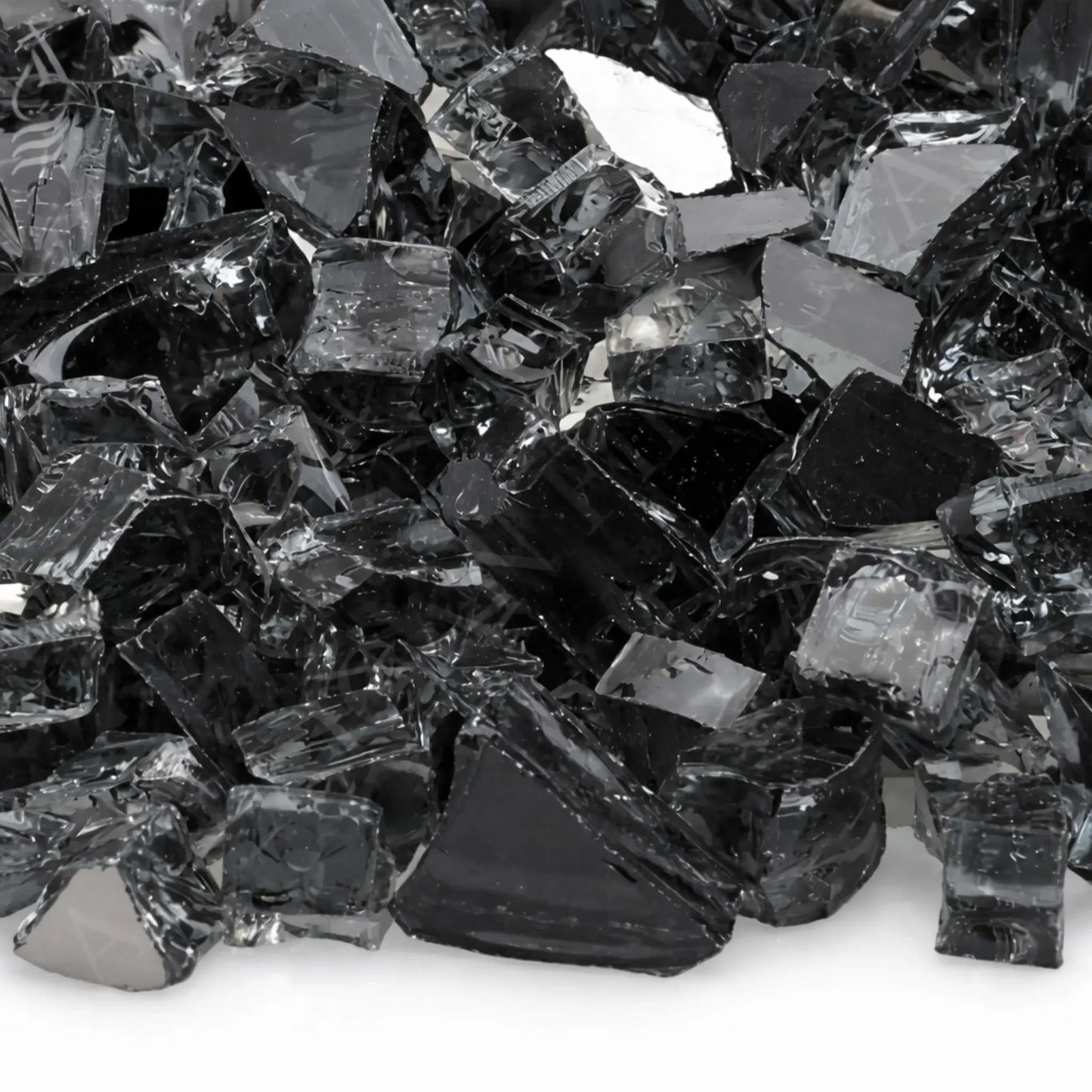 Tight close-up of American Fire Products 1/2 inch premium reflective gray fire glass, showcasing smoky translucent tempered pieces with angular cuts, polished edges, and a mirrored backing that catches light and adds depth to gas fire pit installations.